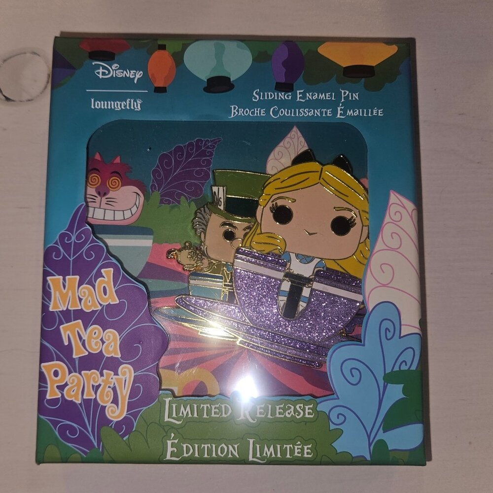 Limited Release Alice in Wonderland slider pin.